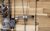 Close-up view of the Adjustable Titanium Cable Guard System - GEN 2 on a camouflaged bow, showcasing enhanced bow control