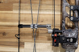 Close-up of the adjustable titanium cable guard system on a bow, featuring a sleek design for improved bow control