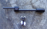 PSE bow accessories bundle featuring a black stabilizer and white dampener, designed for enhanced bow control and minimized noise.